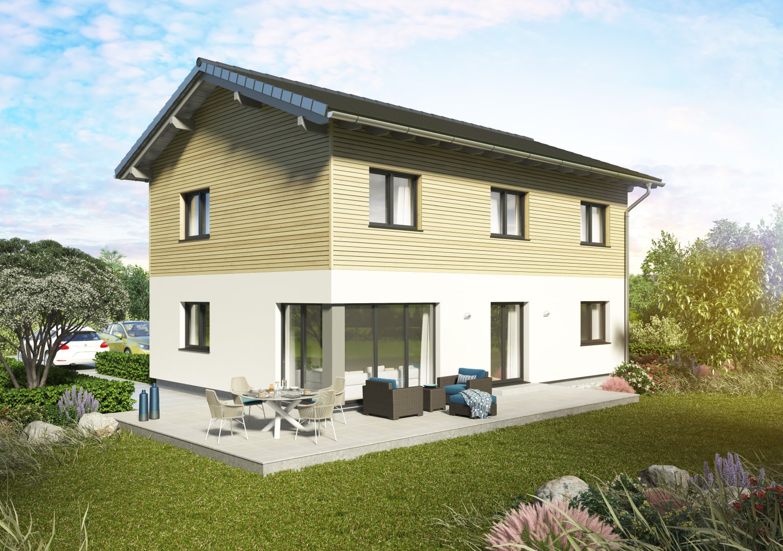 Außenansicht eines zweigeschossigen Einfamilienhauses mit Satteldach, heller Putzfassade und Holzverkleidung im Obergeschoss, Terrasse mit Sitz- und Essbereich, umgeben von Garten und Pflanzen.