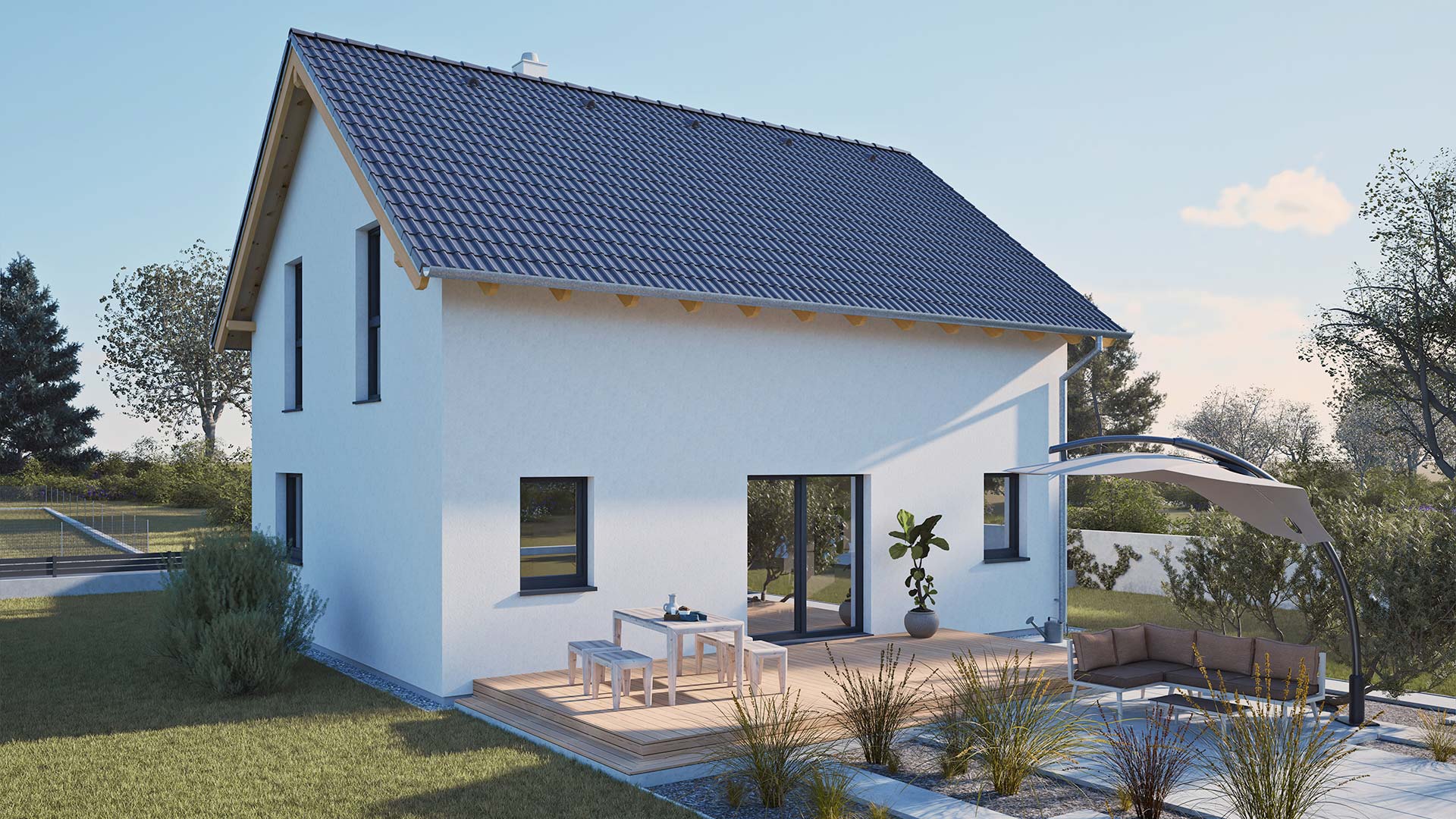 Rückansicht eines Hartl Haus Fertighauses mit Terrasse, Sitzgruppe und Sonnenschutz.
