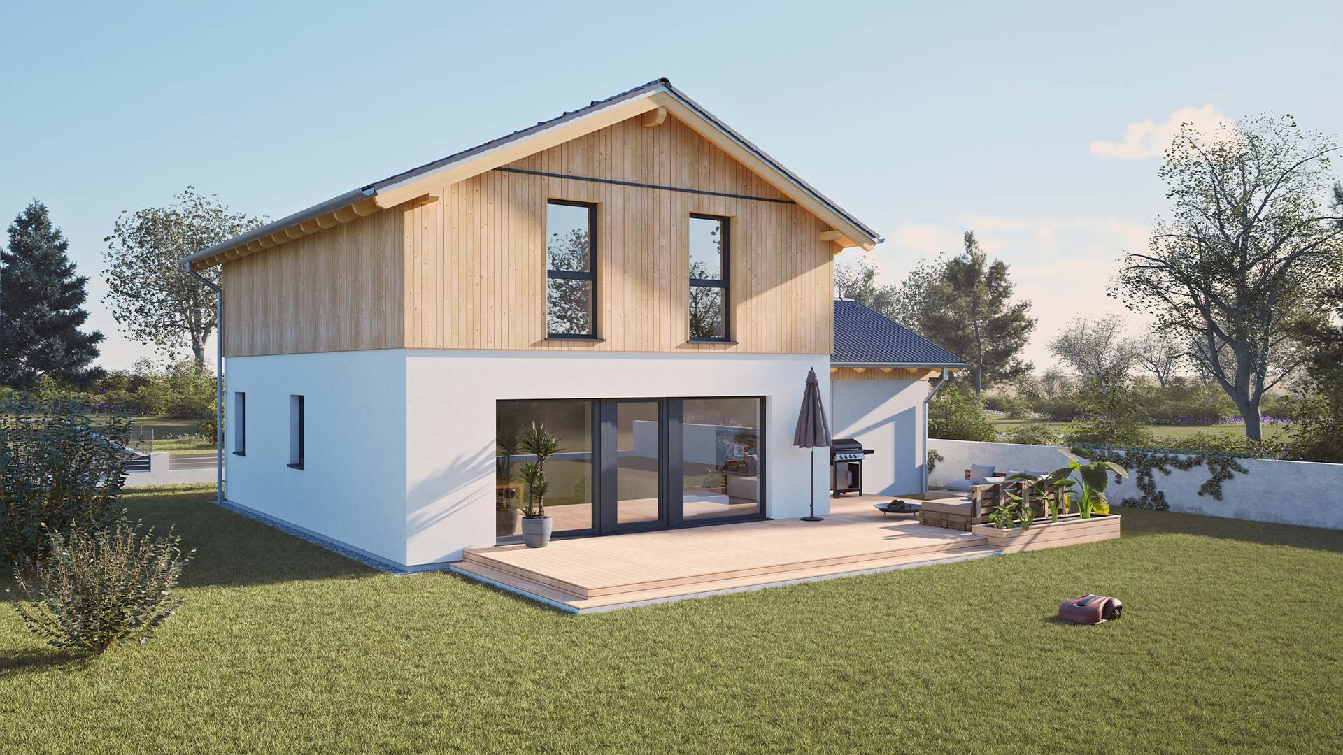 Rückansicht eines modernen Hartl Haus Fertighauses mit Holzverkleidung und Terrasse.