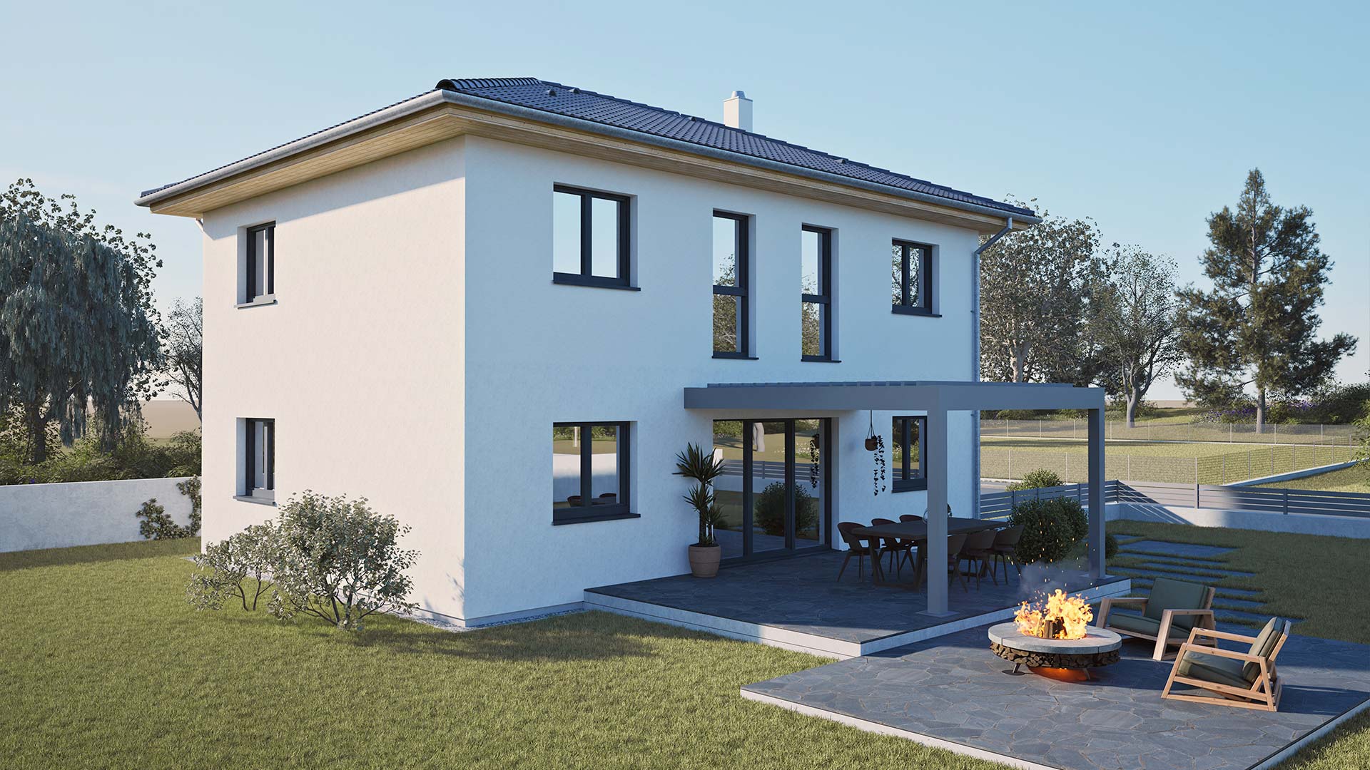Rückansicht eines zweigeschossigen Hartl Haus Fertighauses mit Terrasse und Feuerstelle.