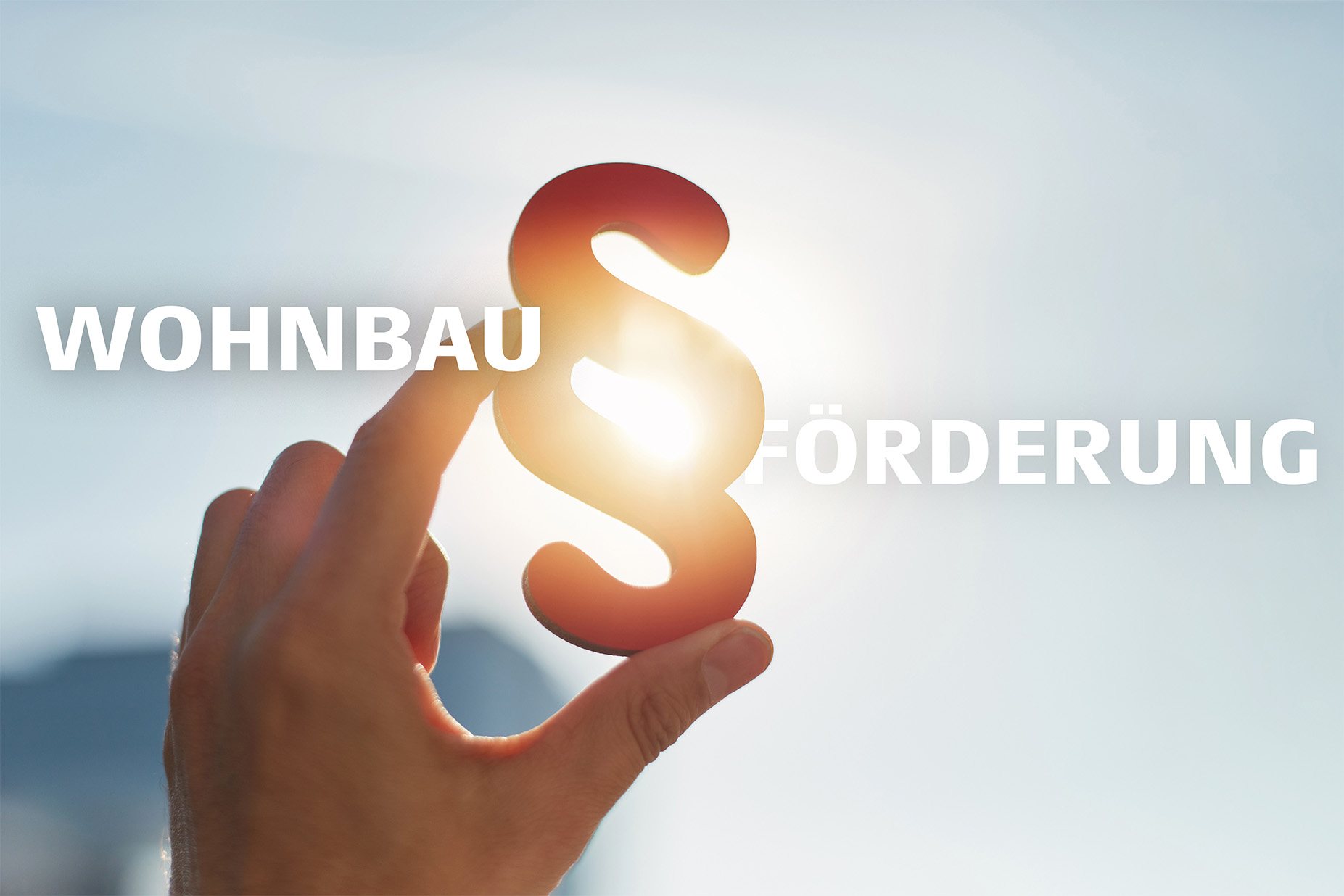 Grafik zur Wohnbauförderung mit Paragrafenzeichen